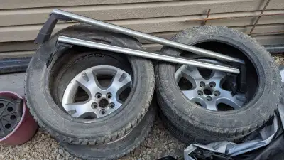 Winter tires pulled from a Toyota matrix with 2 wheels. 205/55 R16 with studs. Snowflake obo best of...
