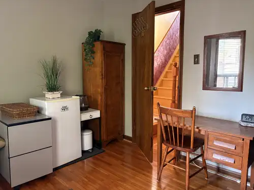 Furnished room in home. Features include: - Comfortable bed - Two desks and 3 chairs - Wardrobe for...
