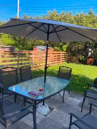 Glass top patio table and 8 chairs