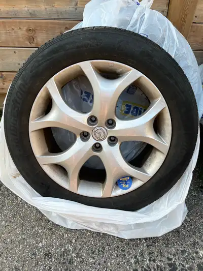 19 inch OEM Mazda rims off of a CX-7 (19x7.5J) with 235-55-19 101H Bridgestone tires. With TPMS. Rim...