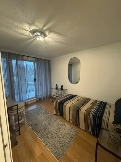 A furnished private bedroom with a shared bathroom is available in a well-maintained three-bedroom a...