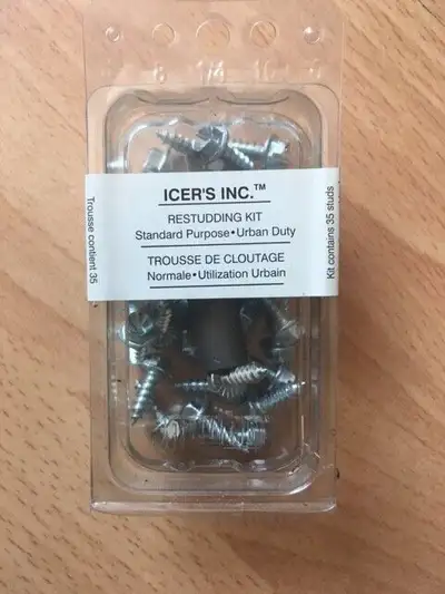 An unopened box of Icer brand replacement studs, and the socket wrench tool for installing and remov...