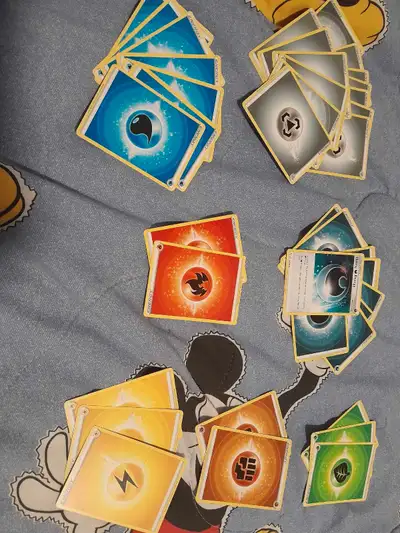 Asourtment of energy cards 2 red, 2 orange, 3 yellow, 3 green, 8 blue, 9 dark blue, 13 grey