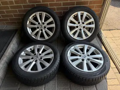 Selling for the rims. 2 tires can be used for another few seasons. Rims in good condition. Can be us...