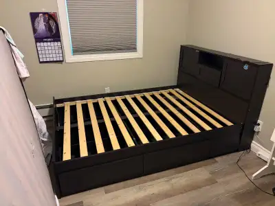 Double bed frame four drawers and to slide out end tables bit of ware on head board.