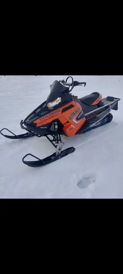 2011 Assault 800, 6000 miles, engine rebuild at 5000m. Track is missing lugs, upgraded front bumper...