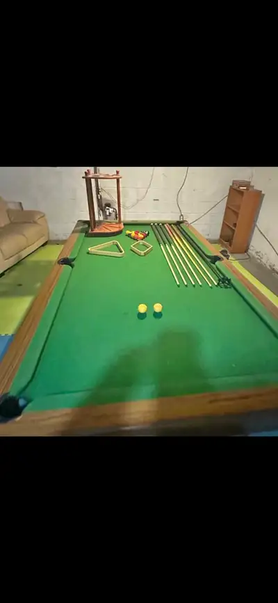 Full size pool table 9’x4.5’.. comes with all the accessories including balls, snooker balls,6 cues...