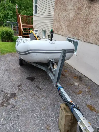 Walker Bay Model 270 AF, 2.70 meters, complete with boat trailer, 8 hp 2 stroke Johnson motor, oars,...
