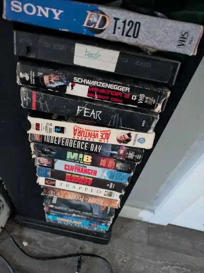 Various types of vhs in this holder just been sitting around not being watched