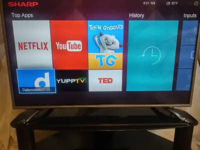 SHARP 40' TV WITH A REMOTE CABLE AND A TV STAND , View more