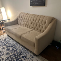 Beige fabric three seat couch