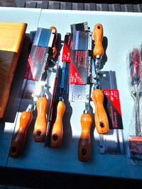 Assortment of tools saws and chisels