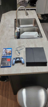 PS4 with controller & 2 games 