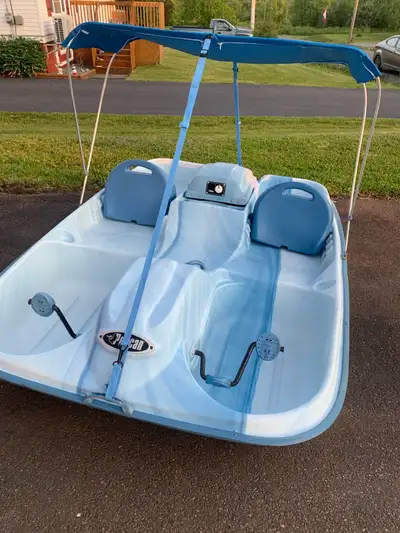 For sale Pelican Electric paddle boat. The marine battery is charged and ready to use. Canopy is bra...