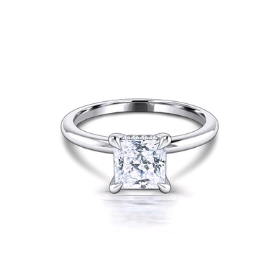 This ring features a 1 carat princess cut moissanite resting above 0.04tcw accent diamonds. With a f...