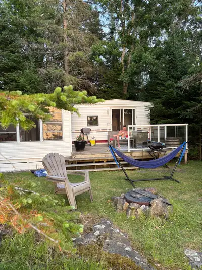 2009 General Coach 34’ one-bedroom park model trailer for sale. On a beautiful and very private wate...