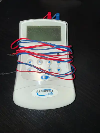 TENS MACHINE - small hand-held, portable, battery operated, View more