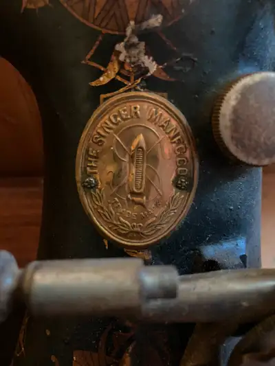 Antique Singer sewing machine for sale, in great shape with original part box, asking for $250.00, i...