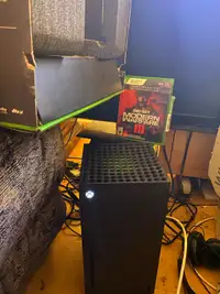 Xbox series X with box 2 controllers and MW3