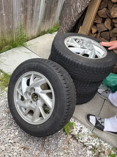 Selling a set of four tires on aluminum rims , only used for the past winter as I sold the car they...