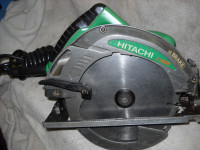 Scie radial elec. Hitachi 7 1/4 po. Verte/grise. Bonne condition