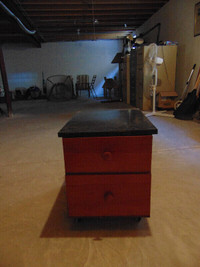 two drawers in cabinet/dresser with black fermica top.