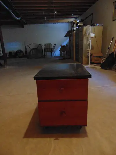 2 drawers in cabinet/dresser with black fermica top; cabinet is on coasters/rollers. 19inches h; x 2...