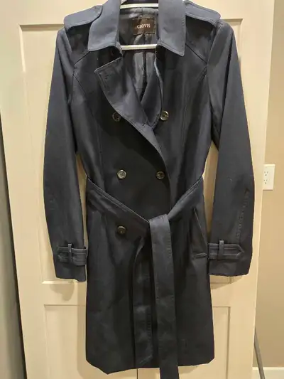 This stylish, gently worn Trench coat is perfect for transitioning between seasons, offering both el...