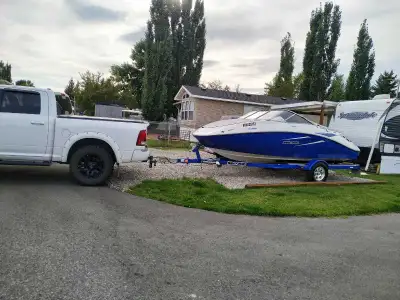 2009 Sea Doo Challenger 180, great condition, new battery, 255 HP. Matching color trailer life has g...