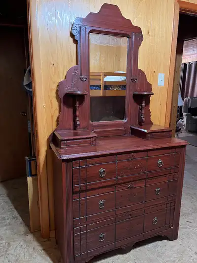 This is a beautiful antique vanity, perfect for adding a touch of vintage charm to any bedroom. This...