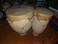 Ceramic pottery and pigskin Bongos drums