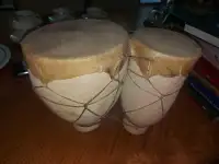 Ceramic pottery and pigskin Bongos drums