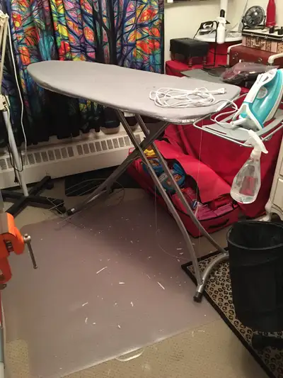 FULL SIZE IRONING BOARD HEAVY DUTY LIKE NEW ( needs new cover ) Extends upto approx 39” with interva...