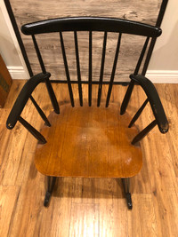 This is a beautiful 1960’s antique black spindled rocking chair