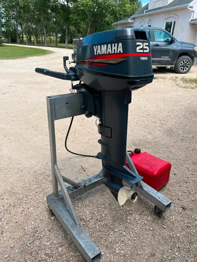1998 25 HP long shaft Yamaha outboard motor. Comes with tank and hose. New water pump installed as w...