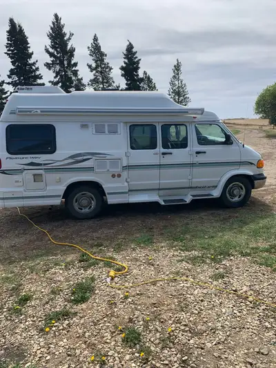 2001 Dodge Ram 3500 Pleasure-way wide body camper van. 5.9 litre V8, 145650km. Has hitch with carrie...