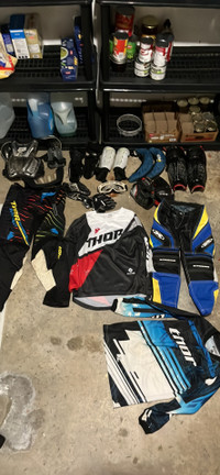 Lot of dirtbike, hockey and soccer equipment