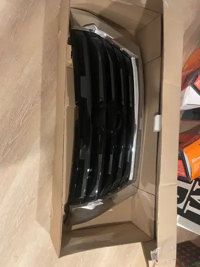 Stock grille, never used. I replaced this one with another one upon purchase or vehicle.