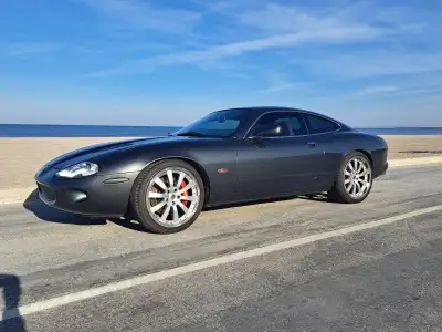 A beautiful example of Jaguar's grand tourer with some tasteful modifications. It's styling resemble...