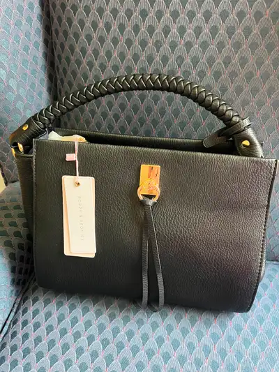 Lovely black handbag with a thick braided handle Appropriate 11x8x4 inches (widest part) Check out p...