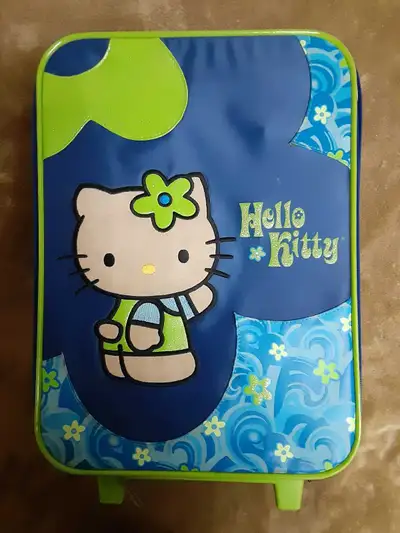 I have for sale a small Hello Kitty suitcase containing a lot of 9 barbies, 1 Disney doll, 1 toddler...
