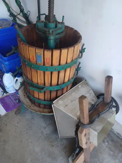 Grape press and crusher made of wood and metal.
