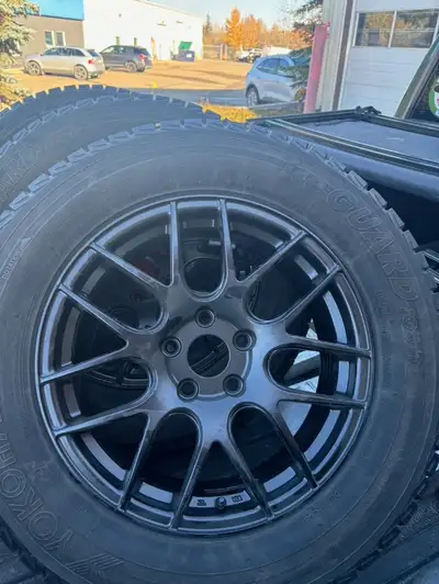 Complete set of Yokohama Ice Guard winter tires 235/65 R17 with 17” black powder coated rims. Only u...