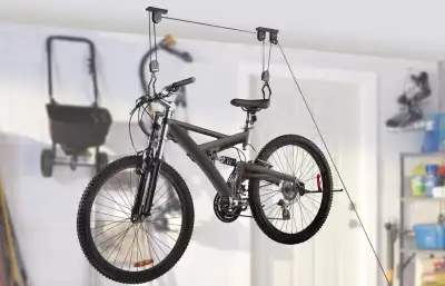 Ceiling Bicycle Lift Lifts bikes up and out of the way Easy lifting - Pulley system reduces weight b...