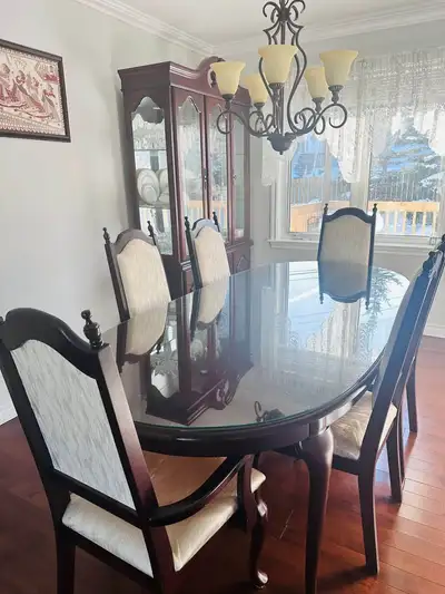 Beautiful solid wood dining table with hutch buffet set. Table comes with glass topper for surface p...