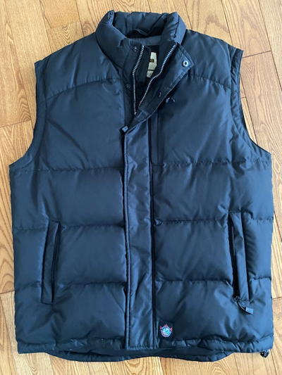 New never worn black men's size L puffer vest. It is light weight yet warm. 3 outside pockets with z...