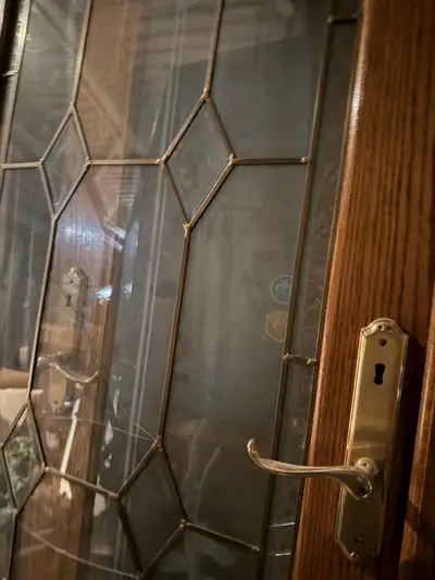 Assortment of solid wood doors with glass inserts.