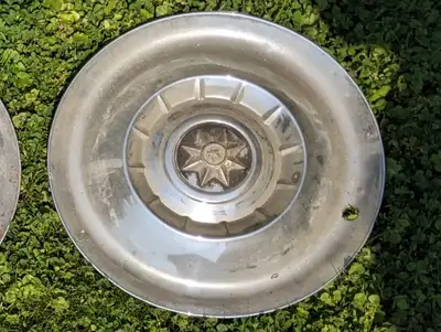 Set Of 4 15" Vintage Wheel Covers, stainless steel in nice condition. Not sure what they are off of....