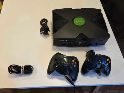 Experience the nostalgia of classic gaming with this original Microsoft Xbox console, which comes in...