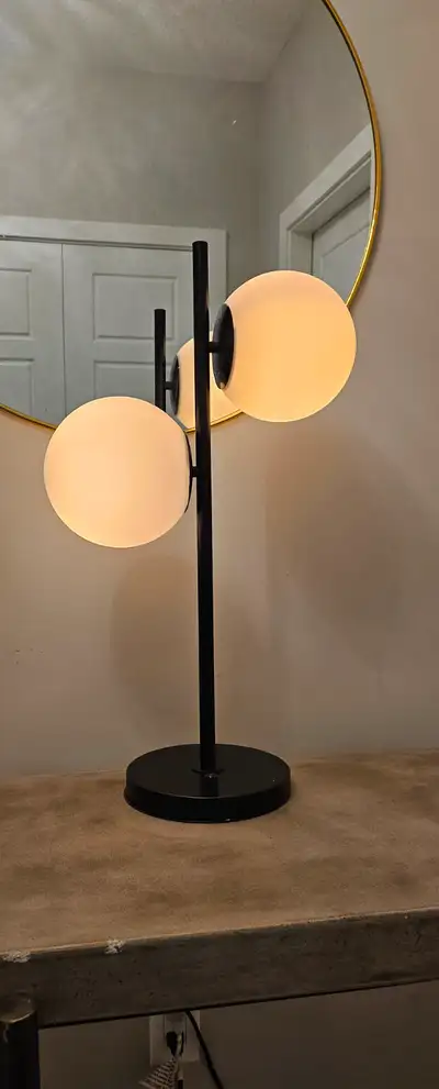 Selling a brand new 2-Light Globe Glass Table Lamp – Black/Black Add modern style and ambient lighti...